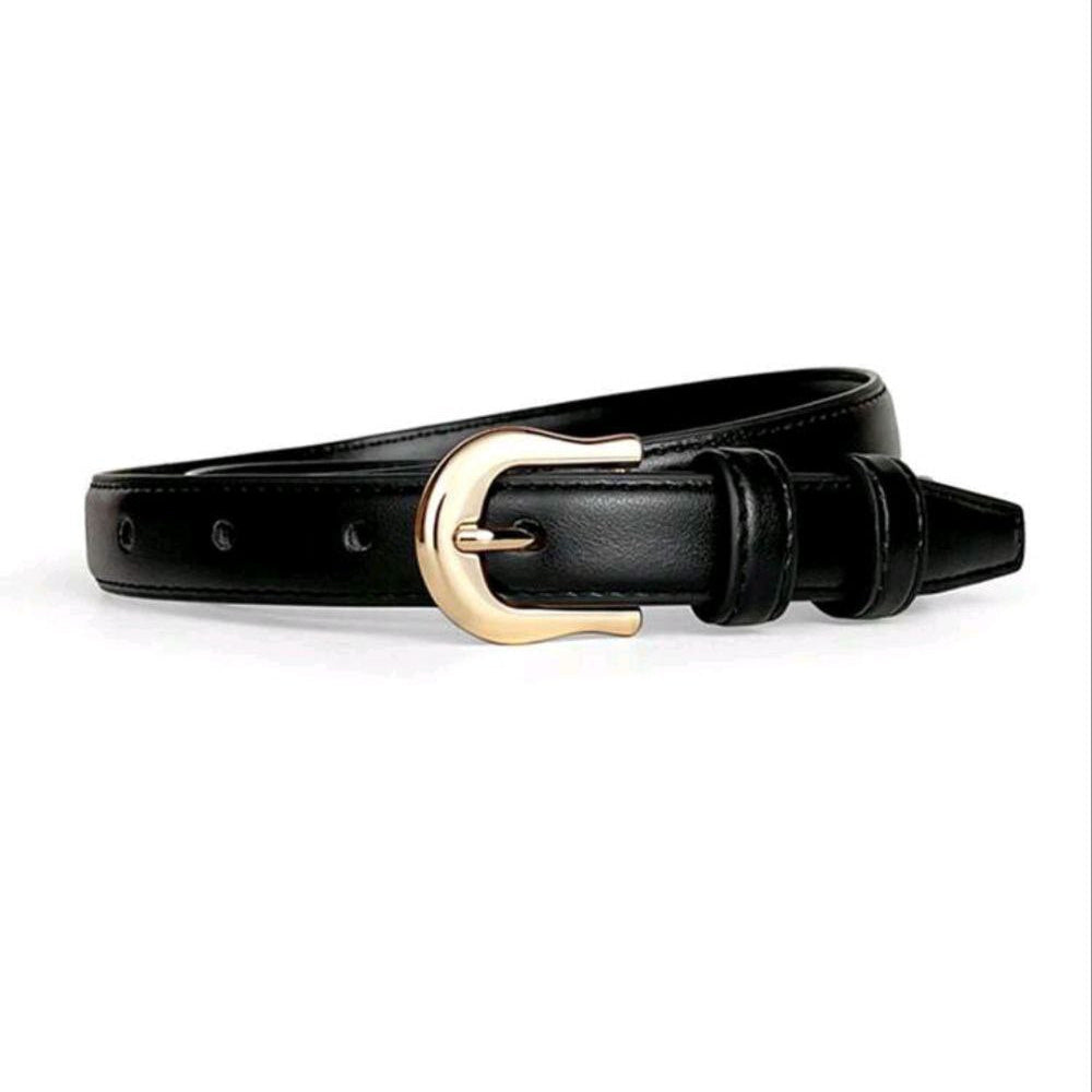 Black belt with a gold buckle on a white background