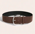 Brown belt with a silver buckle on a beige background