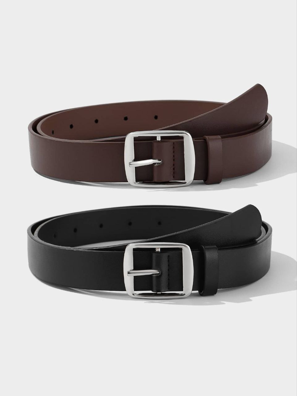 Two belts, one brown and one black, with silver buckles on a white background.