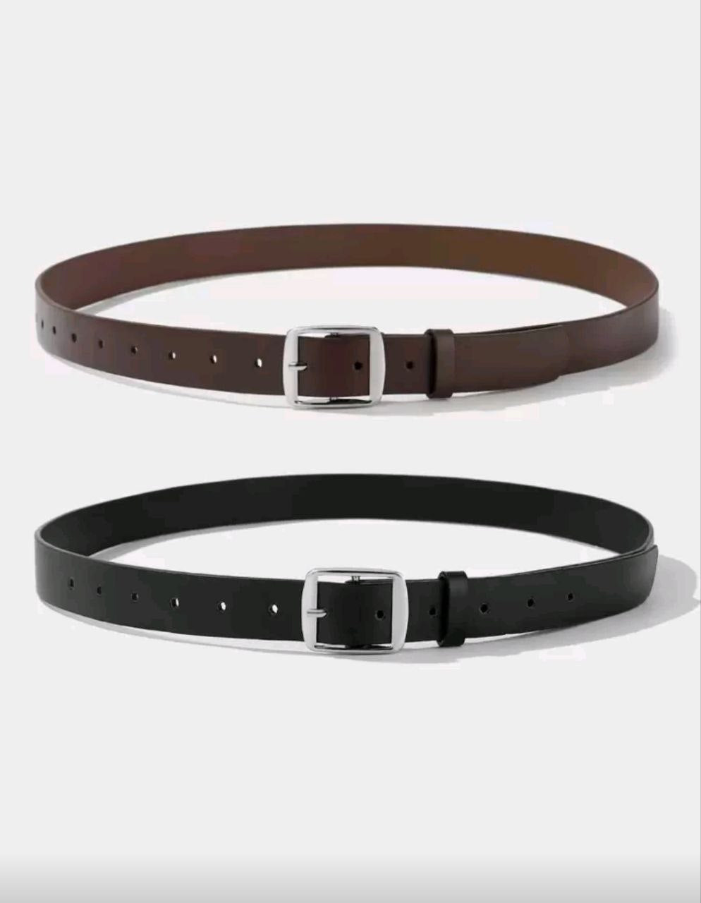 Brown and black leather belts with silver buckles on a white background