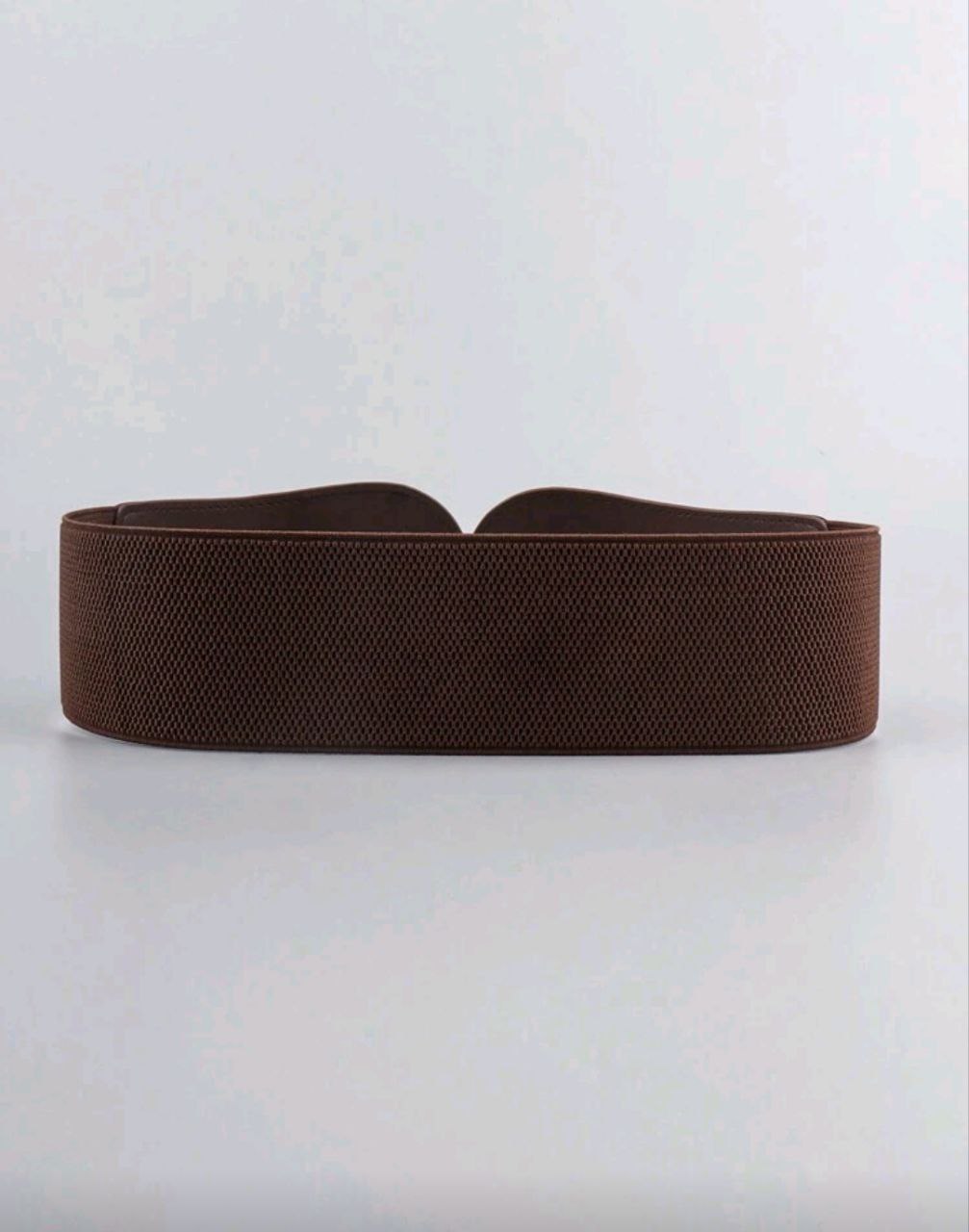 Brown belt on a light gray background