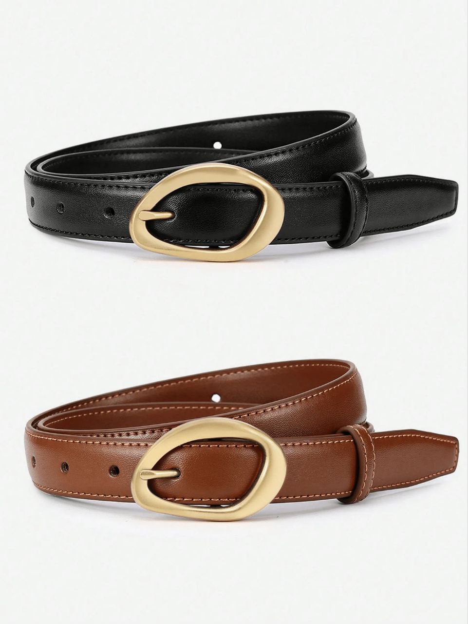 Black and brown leather belts with gold buckles on a white background